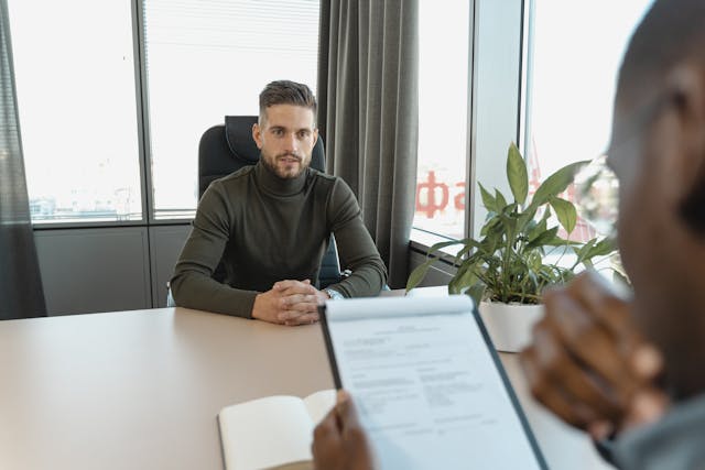 Professional  at office desk during an interview